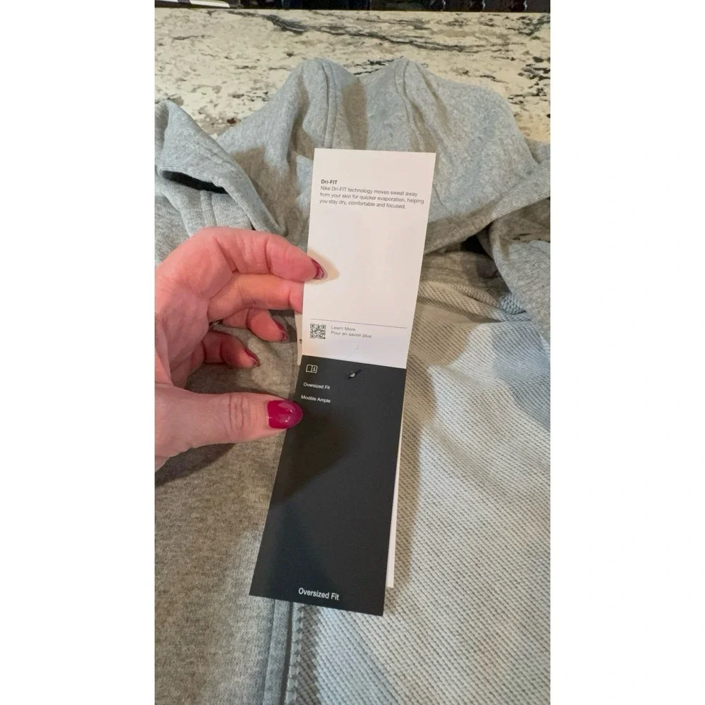 Kids size MEDIUM NIKE oversized fit gray zip up hooded jacket.